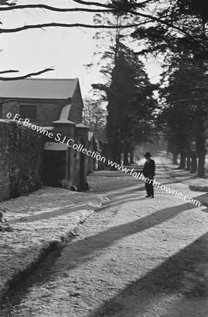 SNOW SCENE ON ROAD OUTSIDE FARM